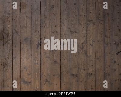 Vieux parquet en bois. Planchers abîmés dans un ton brun foncé et orientation verticale. Arrière-plan de texture de grain de bois. Banque D'Images