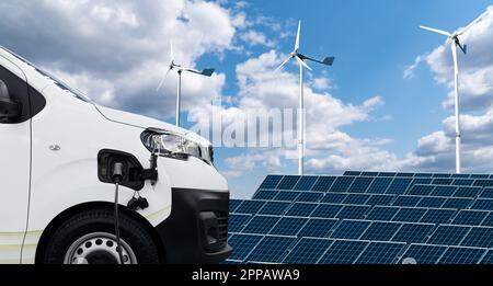 Fourgonnette électrique sur fond de panneau solaire et d'éoliennes. Photo de haute qualité Banque D'Images