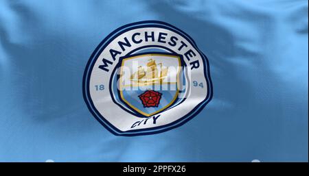 Fond de tissu avec le drapeau de Manchester City ondulant Banque D'Images