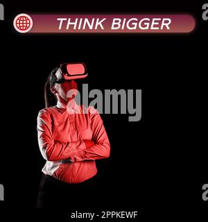 Écriture affichage du texte pensez plus grand. Idée d'affaires être en mesure de rêver et de visualiser ce que vous pouvez réaliser Banque D'Images