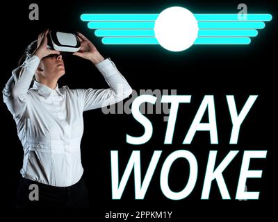 Panneau affichant STStay Woke. Vitrine d'affaires être conscient de votre environnement et des choses en cours rester informé Banque D'Images
