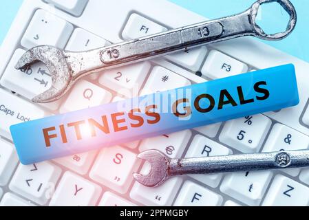 Signe d'écriture à la main objectifs de forme physique. Concept signifiant graisse lâche construire muscle obtenir plus de conditionnement Banque D'Images