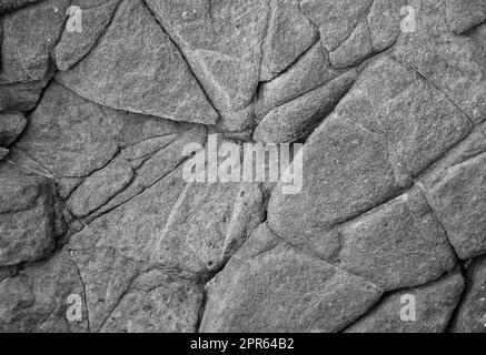 Une texture de pierre d'une roche qui a une origine volcanique. Banque D'Images