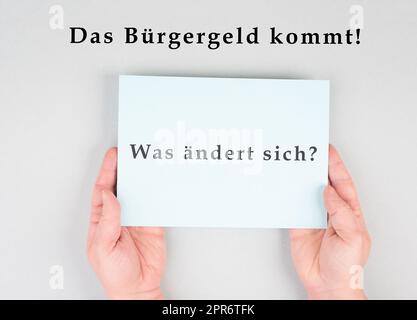 Le mot allemand pour l'argent des citoyens figure sur un papier, nouveau système d'aide financière pour le chômage en Allemagne, question sociale Banque D'Images