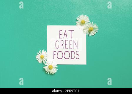 Inspiration montrant l'enseigne manger des aliments verts. Idée d'affaires manger plus de légumes alimentation saine végétarienne personne de veggie Sticky Note avec des messages importants avec des fleurs des deux côtés. Banque D'Images