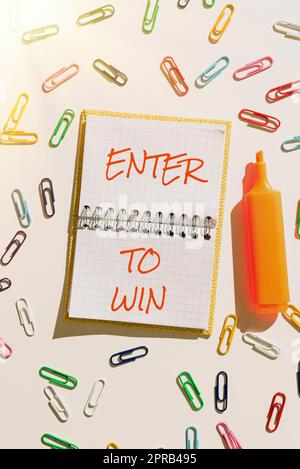 Inspiration montrant le signe entrer pour gagner. Concours de concept d'affaires tenter la chance de gagner le grand prix Loterie message important écrit sur le carnet avec des trombones colorés autour. Banque D'Images