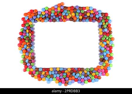 Bordure de cadre de bonbons multicolores halloween sur blanc Banque D'Images