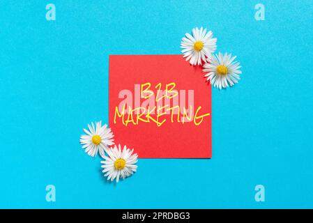 Texte montrant inspiration B2B Marketing. Concept d'affaires Partenariat Entreprises chaîne d'approvisionnement Fusion des fils revendre Sticky Note avec des messages importants avec des fleurs des deux côtés. Banque D'Images