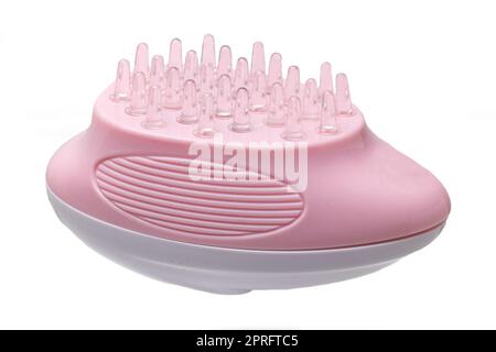 Gros plan sur une brosse de massage du cuir chevelu à piles, une brosse à shampooing ou un masseur pour le cuir chevelu pour exfolier et masser le cuir chevelu. Concept de beauté et de santé. Banque D'Images