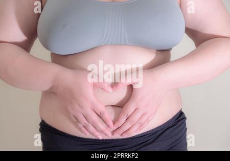 Femme gras, façonner un muscle sain d'estomac, et le mode de vie de régime Banque D'Images