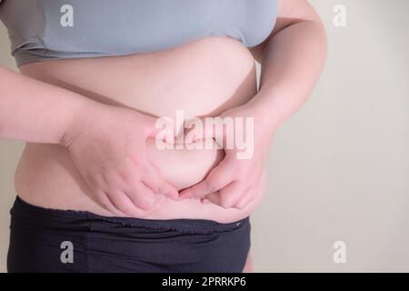 Femme gras, façonner un muscle sain d'estomac, et le mode de vie de régime Banque D'Images