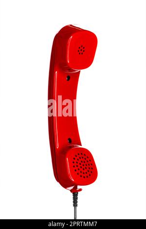 Combiné rouge d'un téléphone des années 80 vintage isolé sur fond blanc Banque D'Images