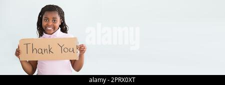 Girl Holding Merci Sign Banque D'Images