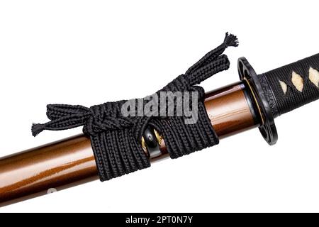 Black color Sageo - Japanese sword sheath rope made of high quality silk isolated on white background. Selective focus. Stock Photo