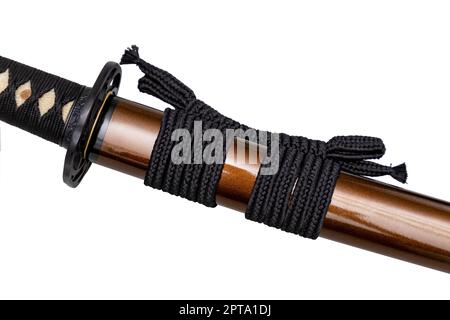 Black color Sageo - Japanese sword sheath rope made of high quality silk isolated on white background. Selective focus. Stock Photo
