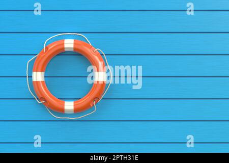 Anneau de bouée de sauvetage orange au sol bleu Banque D'Images
