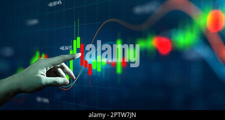 Graphique et graphique avec bougeoirs d'affaires à l'aide d'un doigt.Négociation en ligne, investissement, plan de marché stratégique, et marché boursier fl Banque D'Images