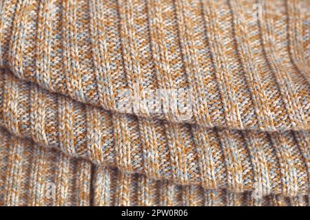 Pull en laine tricotée beige tacheté. Détail de Texture close up. Banque D'Images