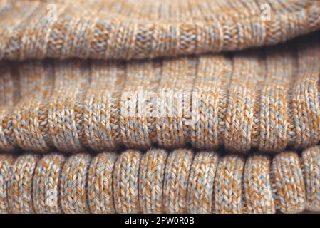 Pull en laine tricotée beige tacheté. Détail de Texture close up. Banque D'Images