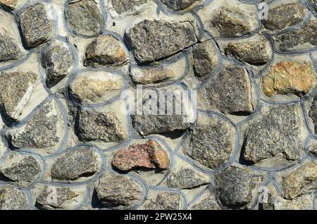 Couleur gris Modèle de style moderne décoration design pierre fissurée inégale à la surface du mur avec du ciment Banque D'Images