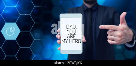 Signe d'écriture main papa, vous êtes mon héros, concept signifiant l'admiration pour votre père sentiments d'amour compliment Banque D'Images