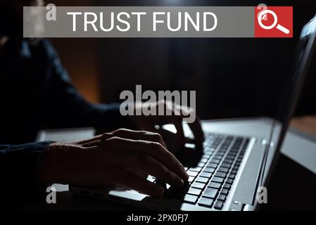 Rédaction affichant le texte Fonds de fiducie, entreprise montre l'argent qui est détenu par les fiduciaires pour les bénéficiaires Banque D'Images