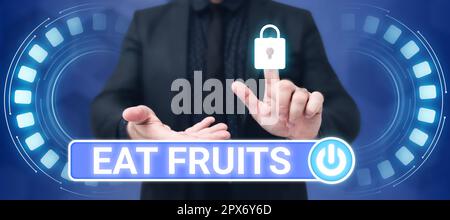 Écriture affichant le texte manger des fruits, mot pour consommer tout produit de la croissance de la plante utile aux humains ou aux animaux Banque D'Images