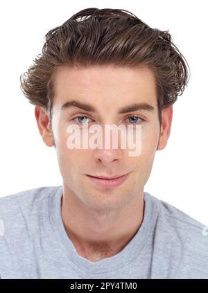 Photo de l'homme, du visage et de la confiance dans le portrait, jeune génération z isolé sur fond blanc. Modèle masculin attrayant, en regardant droit devant Banque D'Images