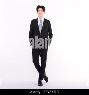 Portrait complet d'un jeune homme d'affaires debout Banque D'Images