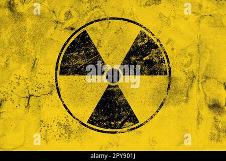 Signe radioactif noir sur fond jaune Banque D'Images
