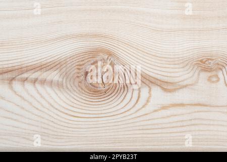 Texture d'arrière-plan. Surface d'une planche bordée de mélèze avec noeud sur la coupe. Texture du bois. Vue de dessus. Espace de copie. Banque D'Images