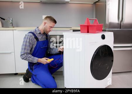 Problème de réparation du lave-linge Banque D'Images