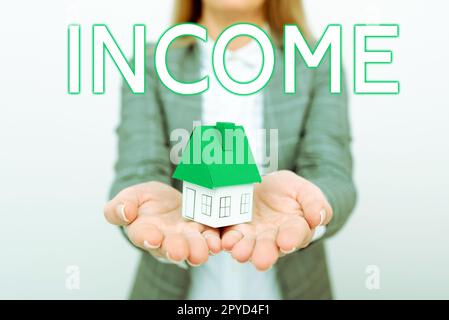 Symbole de texte indiquant le revenu. Photo conceptuelle argent reçu en particulier sur une base régulière pour le travail ou les investissements Banque D'Images