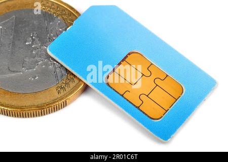 Carte SIM et pièce en euro de l'argent, Close up Banque D'Images