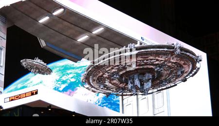 Computer graphics 3D image of a UFO (unidentified flying object) is projected on a curved surface screen in front of Shinjuku Station east entrance at Cross Shinjuku Vision in Shinjuku Ward, Tokyo on April 23, 2023. The image of the UFO has been projected on 4K resolution screen 8.16m x 18.96m on the 4th floor of the Cross Shinjuku Building.( The Yomiuri Shimbun via AP Images )