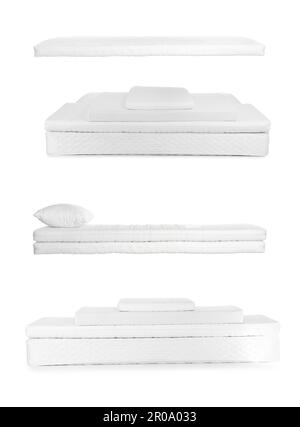 Set avec de nouveaux matelas confortables sur fond blanc Banque D'Images