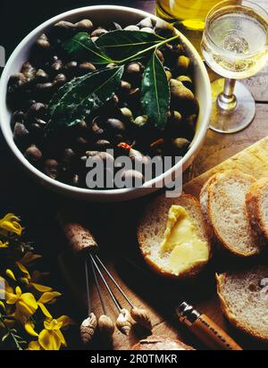 Bigorneaux et vin blanc Banque D'Images