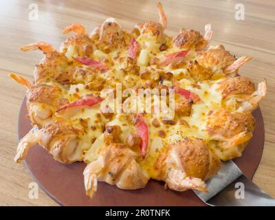 La chaîne de restaurants de franchise internationale propose des styles de pizza, stock photo Banque D'Images