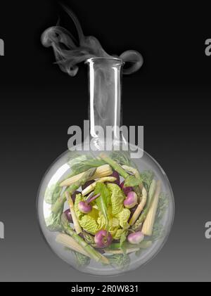 Légumes dans une bouteille de test chimique en verre Banque D'Images