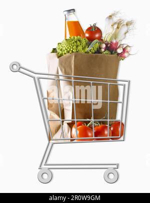 Mini chariot de supermarché avec un sac de légumes en papier brun Banque D'Images