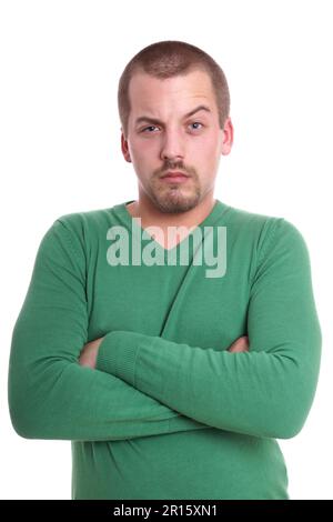 Jeune homme méfiant avec Raised Eyebrow Banque D'Images