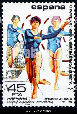 ESPAGNE - VERS 1985: Un timbre imprimé en Espagne montre l'exercice de cerceau, 12th championnats du monde de gymnastique rythmique, Valladolid, vers 1985 Banque D'Images