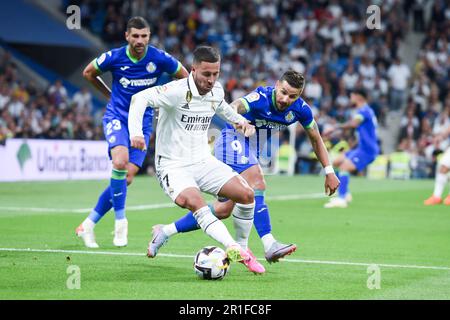 Madrid, Espagne. 13th mai 2023. L'Eden Hazard (C) du Real Madrid rivalise avec le Portu (R) de Getafe lors du match de football espagnol de la Liga à Madrid, Espagne, 13 mai 2023. Credit: Gustavo Valiente/Xinhua/Alamy Live News Banque D'Images