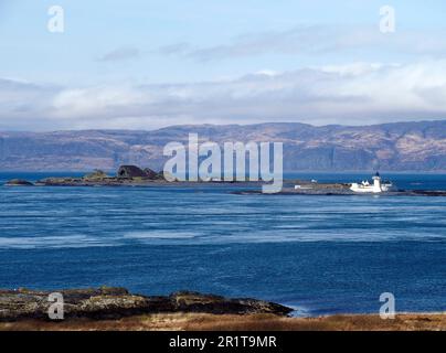 Phare, Flada, avec Belnahua derrière, Slate isles, Écosse Banque D'Images