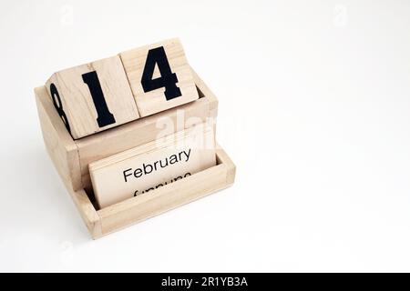 Calendrier perpétuel en bois montrant le 14th février Banque D'Images