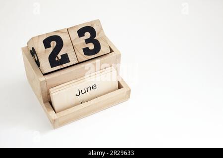 Calendrier perpétuel en bois montrant le 23rd juin Banque D'Images