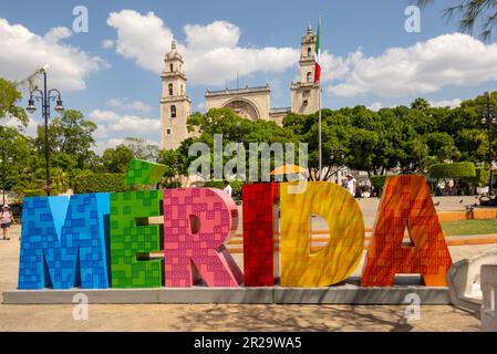 MERIDA sign in the grand park in front of the Cathedral of Merida San Ildefonso church in downtown Merida Yucatan Mexico Stock Photo