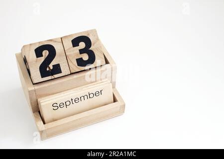 Calendrier perpétuel en bois montrant le 23rd septembre Banque D'Images