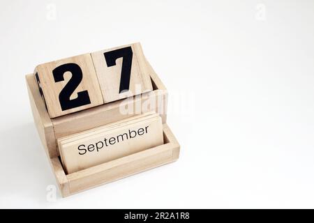 Calendrier perpétuel en bois montrant le 27th septembre Banque D'Images