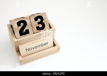 Calendrier perpétuel en bois montrant le 23rd novembre Banque D'Images